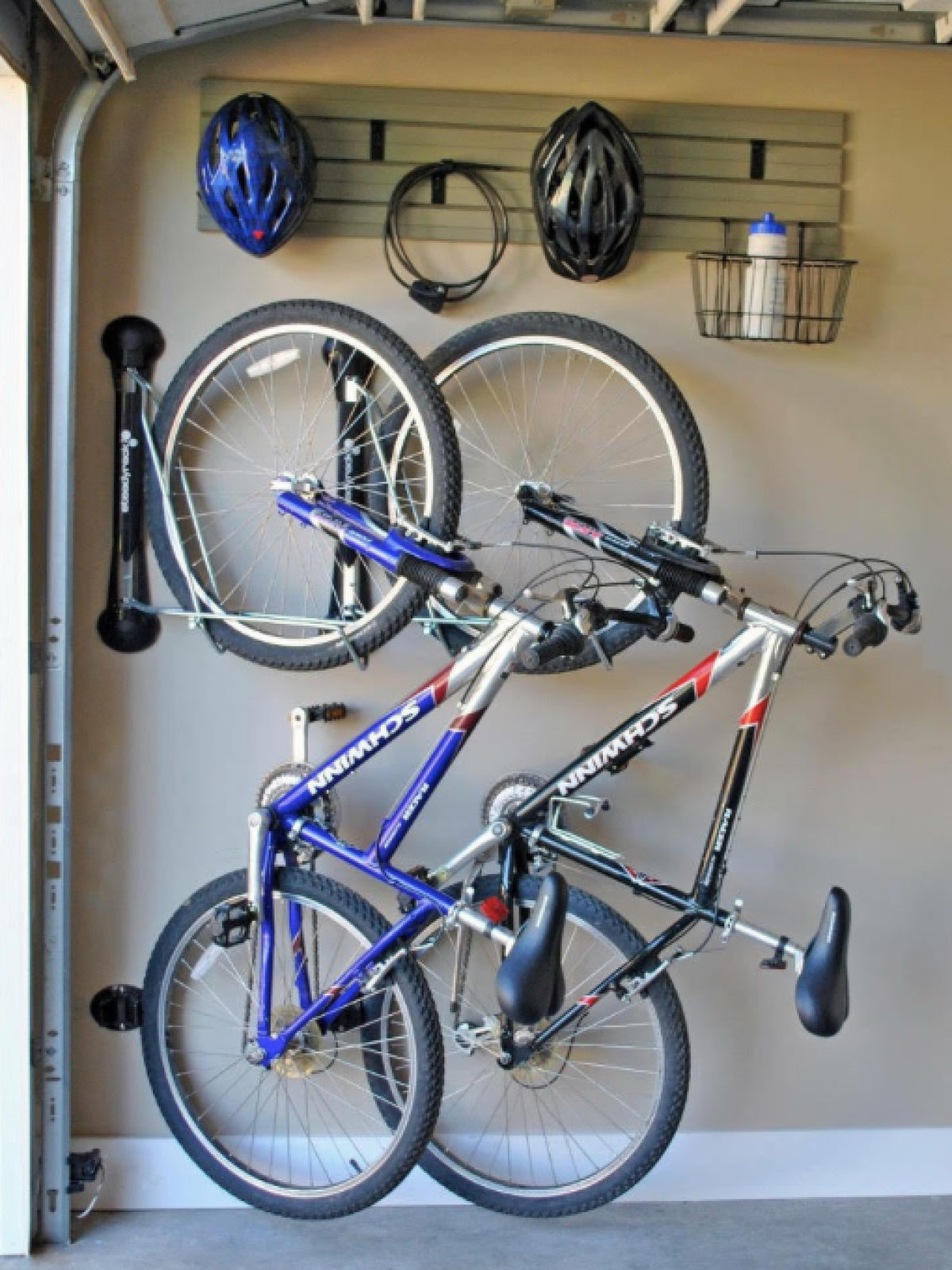 a bicycle parked in front of a blue wall