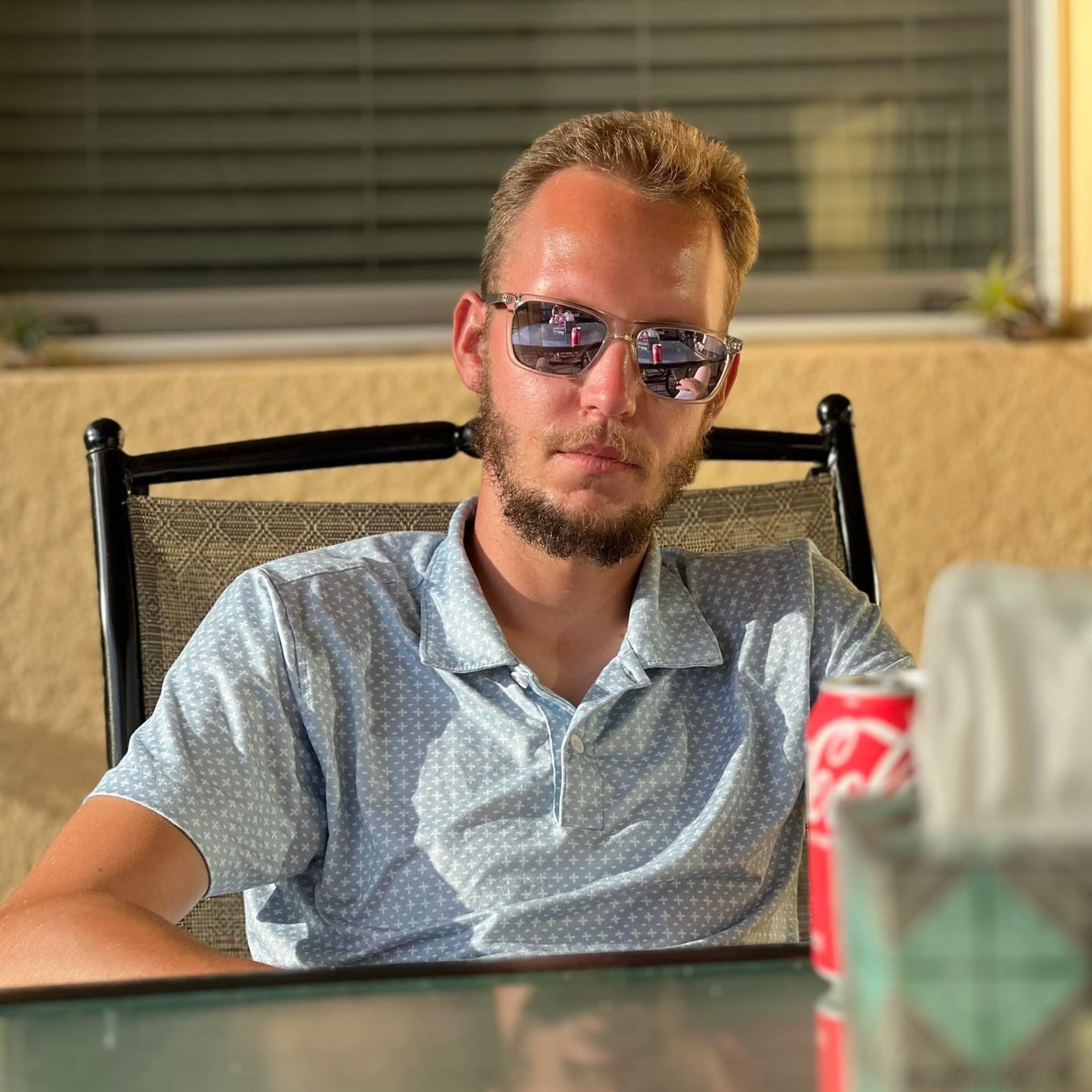 a man sitting in front of a laptop