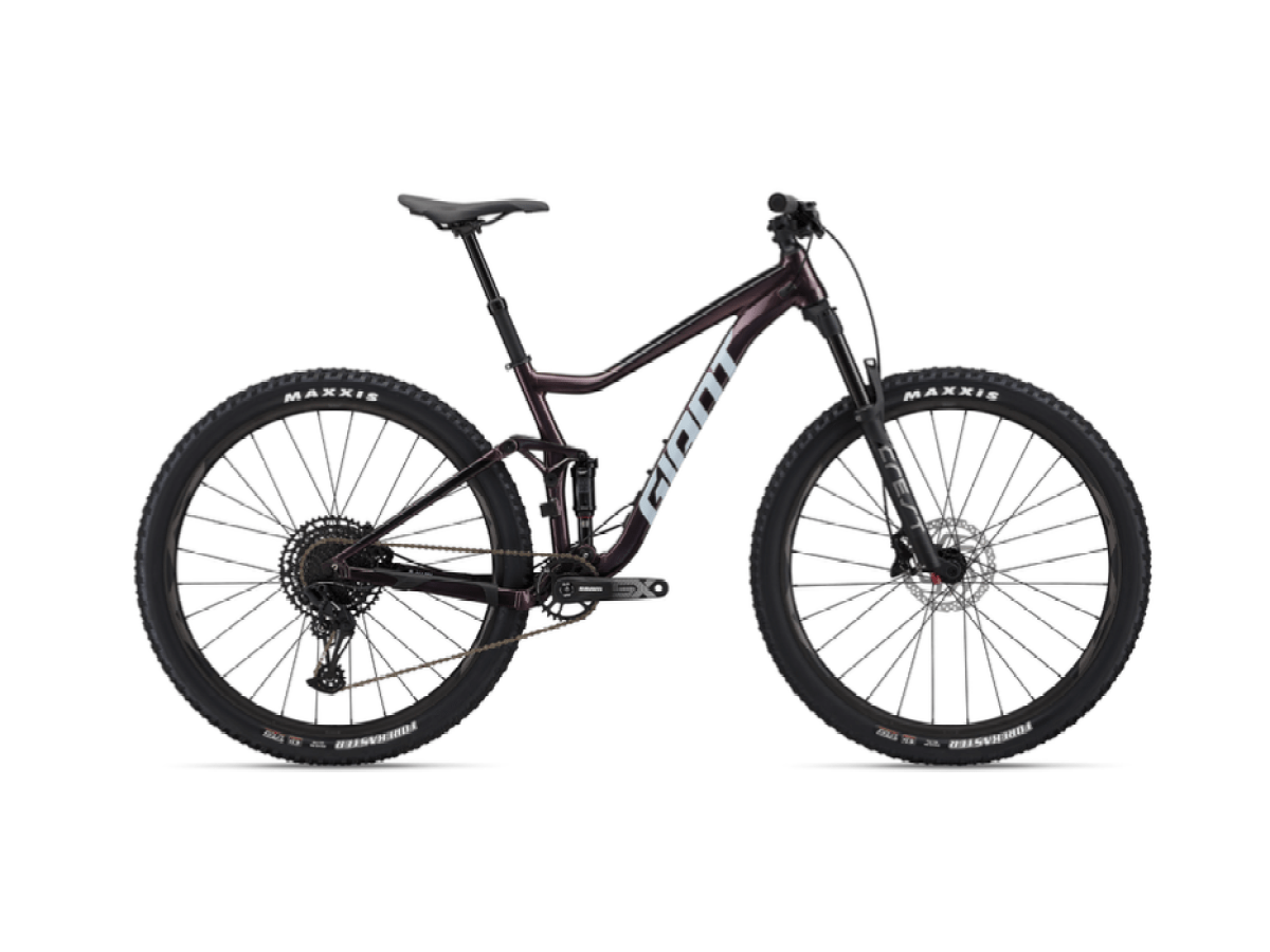 Mountain bike with full suspension and black tires on a white background.