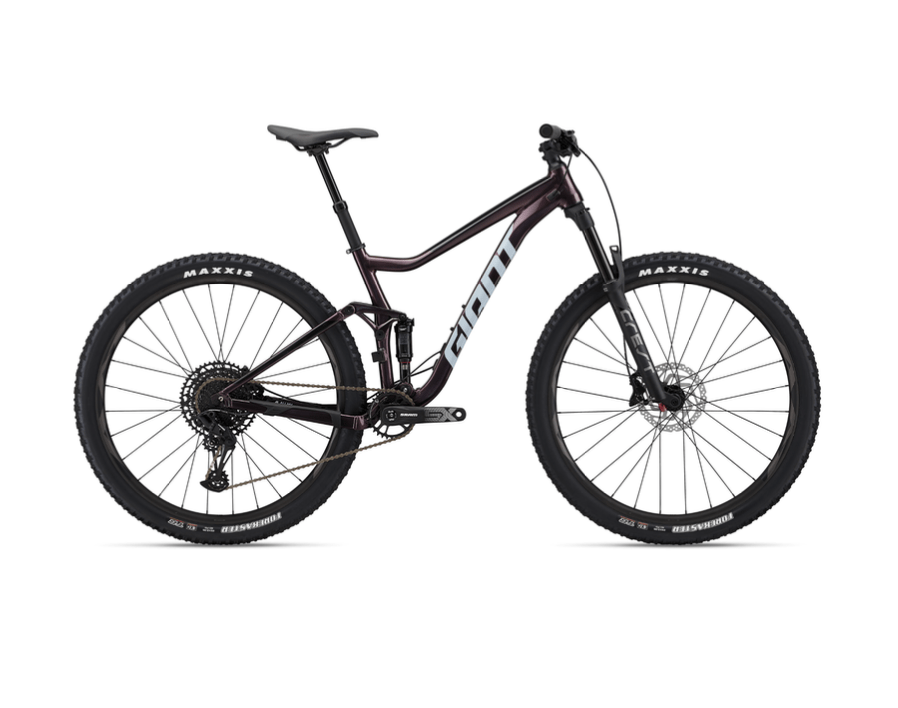 A modern mountain bike with thick tires and a suspension fork, viewed from the side on a white background.